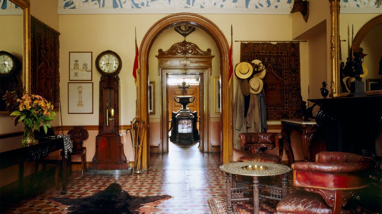 The East Hall, The Argory. Used as the entrance hall from the 1830s. The lances by the door were used by Capt. Shelton in the Crimea. John Wesley sat in one of the c17th chairs to the right.